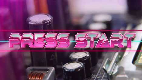 press start text on neon banner against close up of microprocessor connections on motherboard