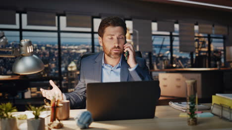 man director arguing cellphone evening workplace closeup. businessman gesturing