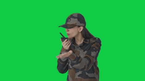 Angry-Indian-woman-army-officer-shouting-on-walkie-talkie-Green-screen