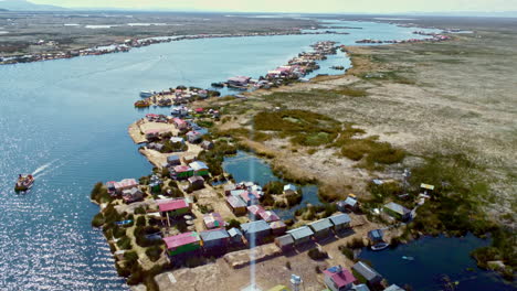 Panoramic-aerial-establishing-dolly-of-Uros-Island-floating-homes-on-Lake-Titicaca