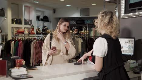 customer making a purchase at a clothing store