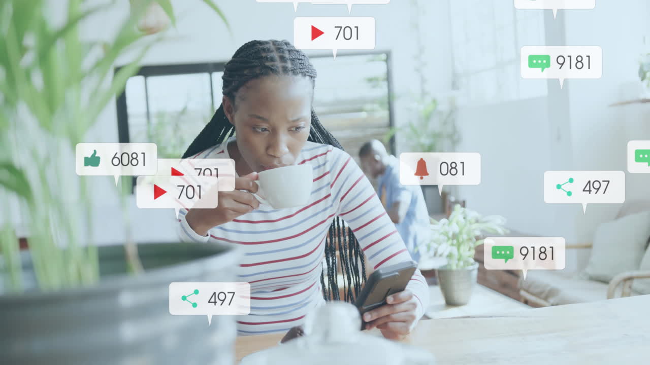 Animation of media icons over biracial woman using smartphone