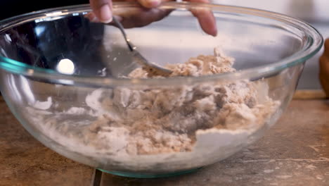 using a fork to mix the wet and dry ingredients for passover bread - slow motion