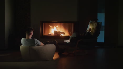 couple relaxing by the fireplace