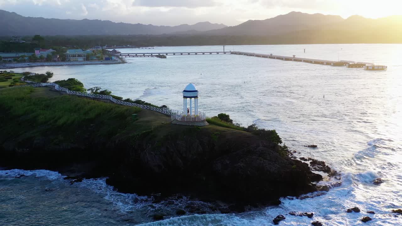 Amazing aerial circling at Puerto Plata cape at sunset, Dominican Republic