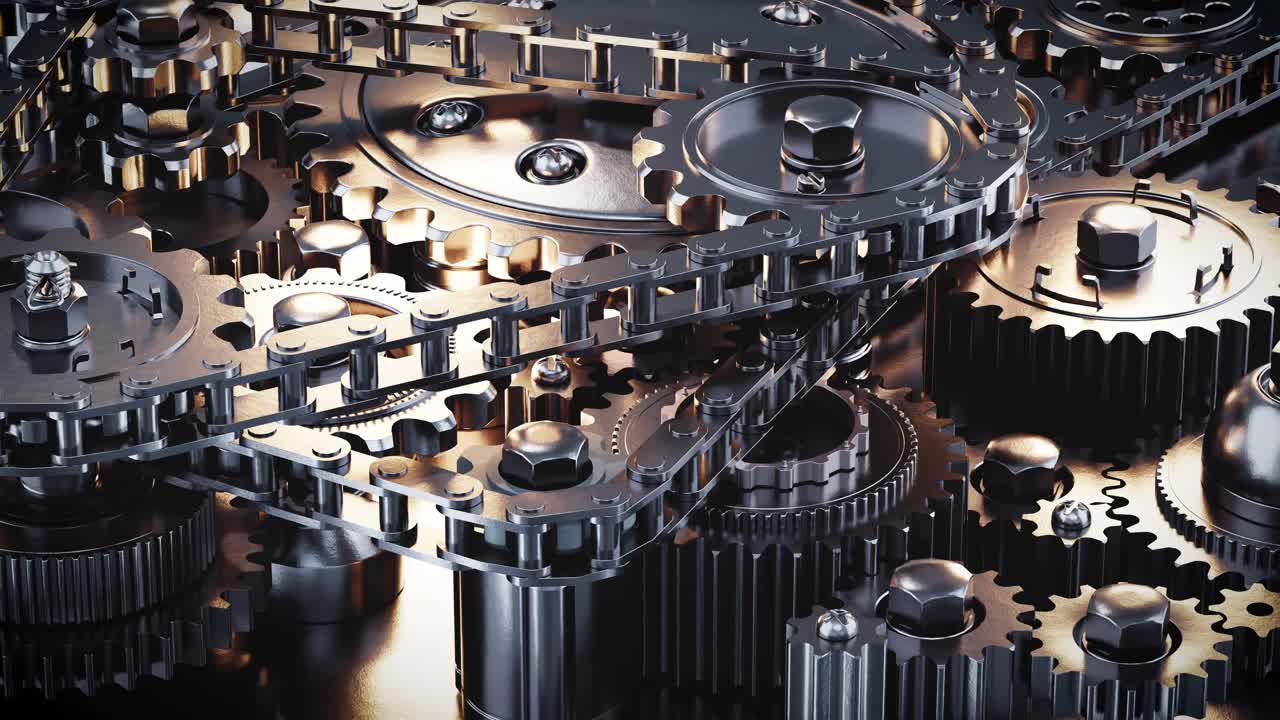 Detail rotujících kovových ozubených kol a řetězového mechanismu