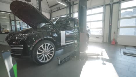 cars undergoing maintenance in auto repair shop