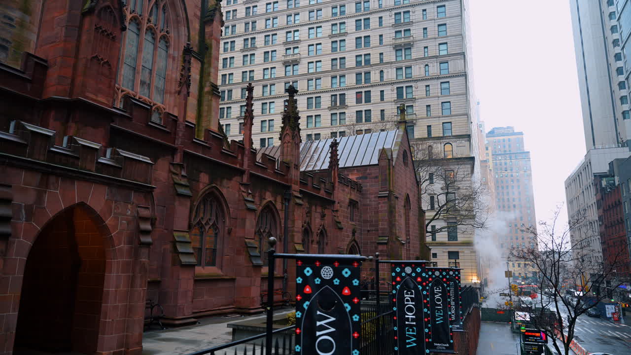 New York, USA, 28 December 2025: Trinity Church exterior in winter Manhattan. Gothic Trinity Church facade with snow in downtown New York