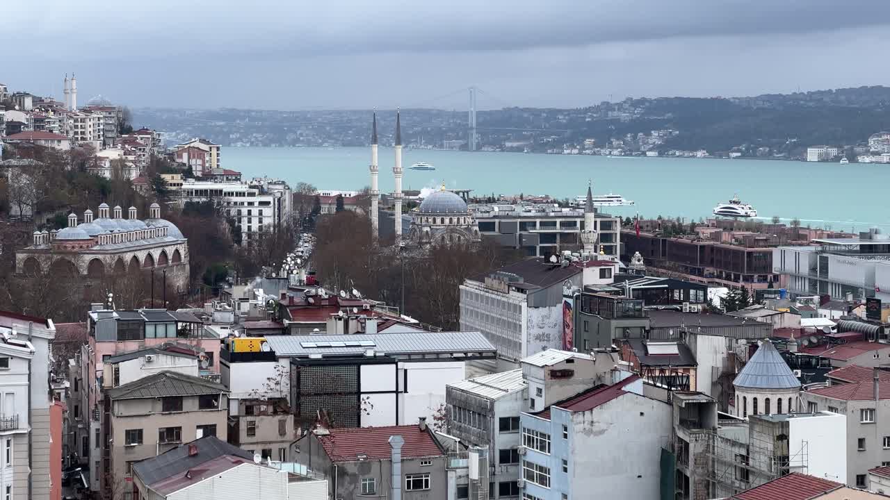 Cinematic view of Galata tower, copy space video, Tourist yacht going nearby.