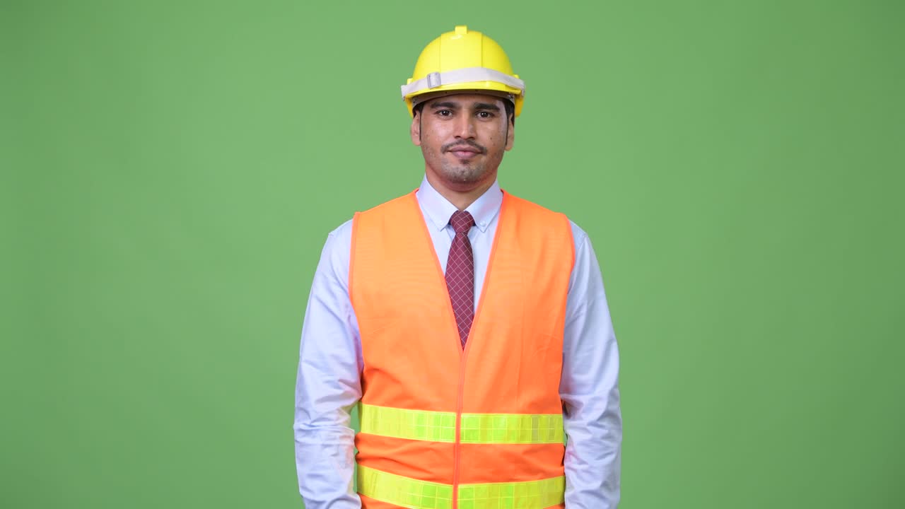 Young handsome Persian man construction worker giving thumbs down