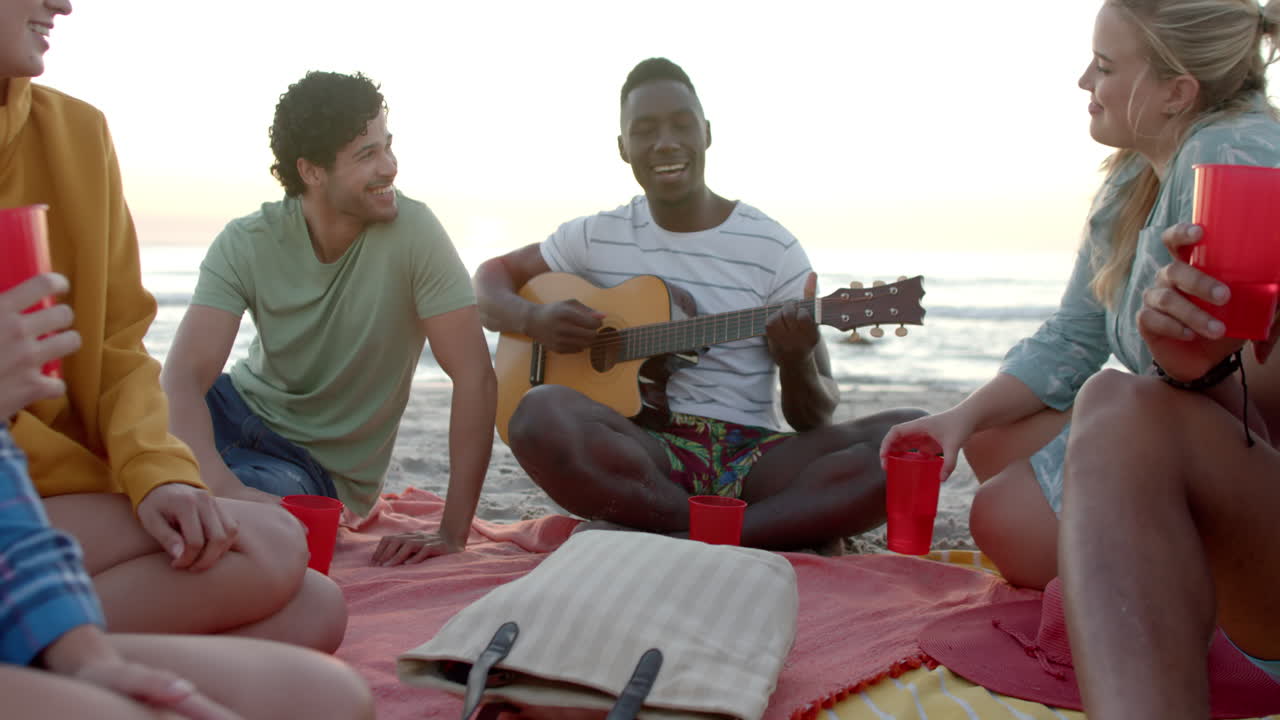 Diverse friends enjoy a beach gathering at a party