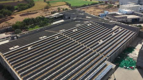 aerial drone view rooftop solar supports sustainable solar power energy.4k video