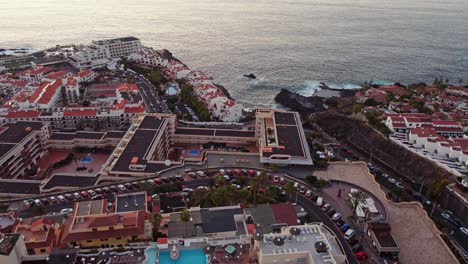 aerial descent focusing in santiago port in los gigantes area in tenerife at sunset