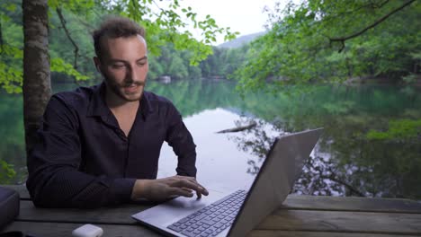 working with a laptop in nature.