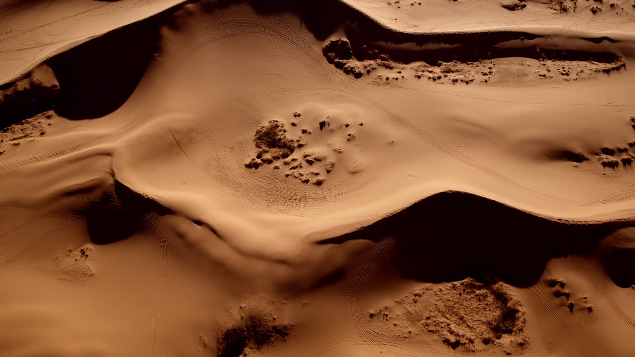 Looking down from the sky, the pink dunes of southern Utah twist into captivating patterns and colors.