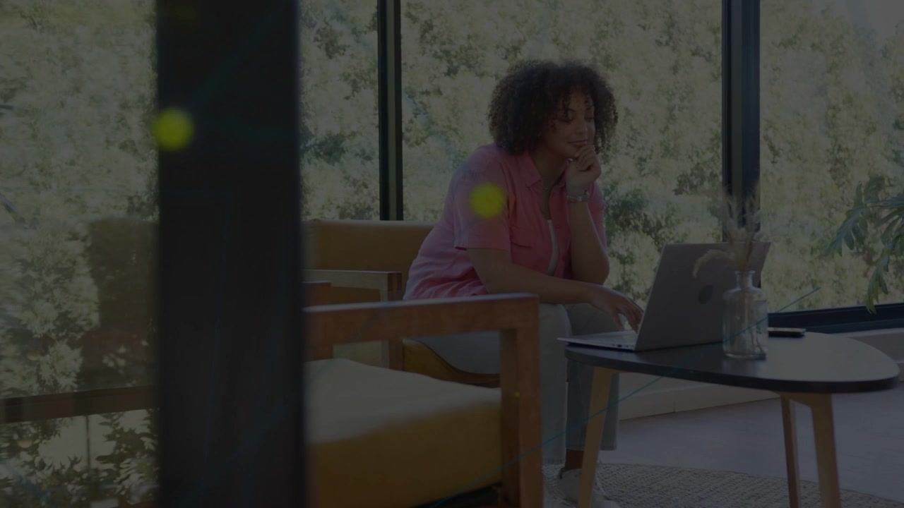 Camera shifting, woman using laptop in lounge leaning, typing, pausing, deciding for remote work