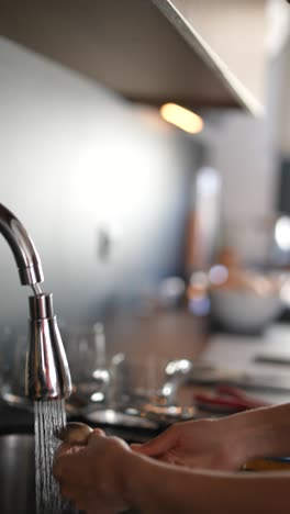 washing dishes in kitchen