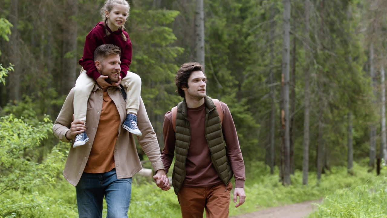 Family enjoying the walk in the forest