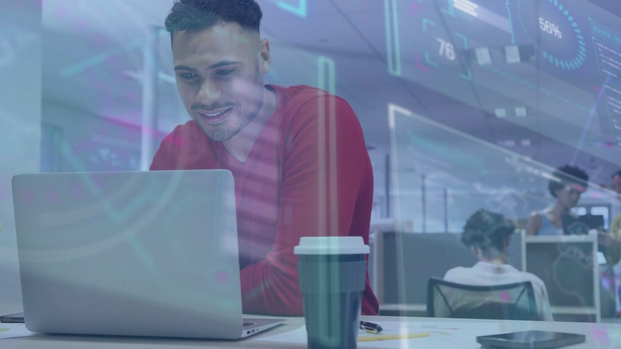 Male office worker leaning into laptop and typing, activating HUD overlays for business data review
