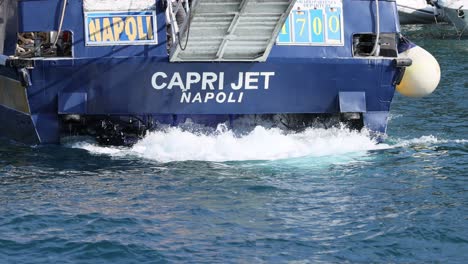 passenger ship leaving sorrento, creating waves