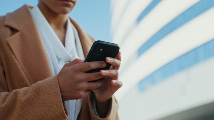 Woman using smartphone in city