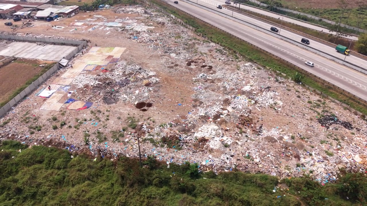 Aerial View of Illegal Dumping Site Near Highway