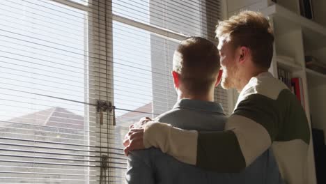 caucasian male couple in social distancing at home