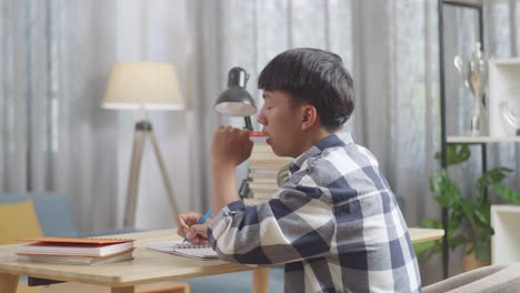 young person studying at home