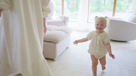 mother and daughter playing in a cozy living room