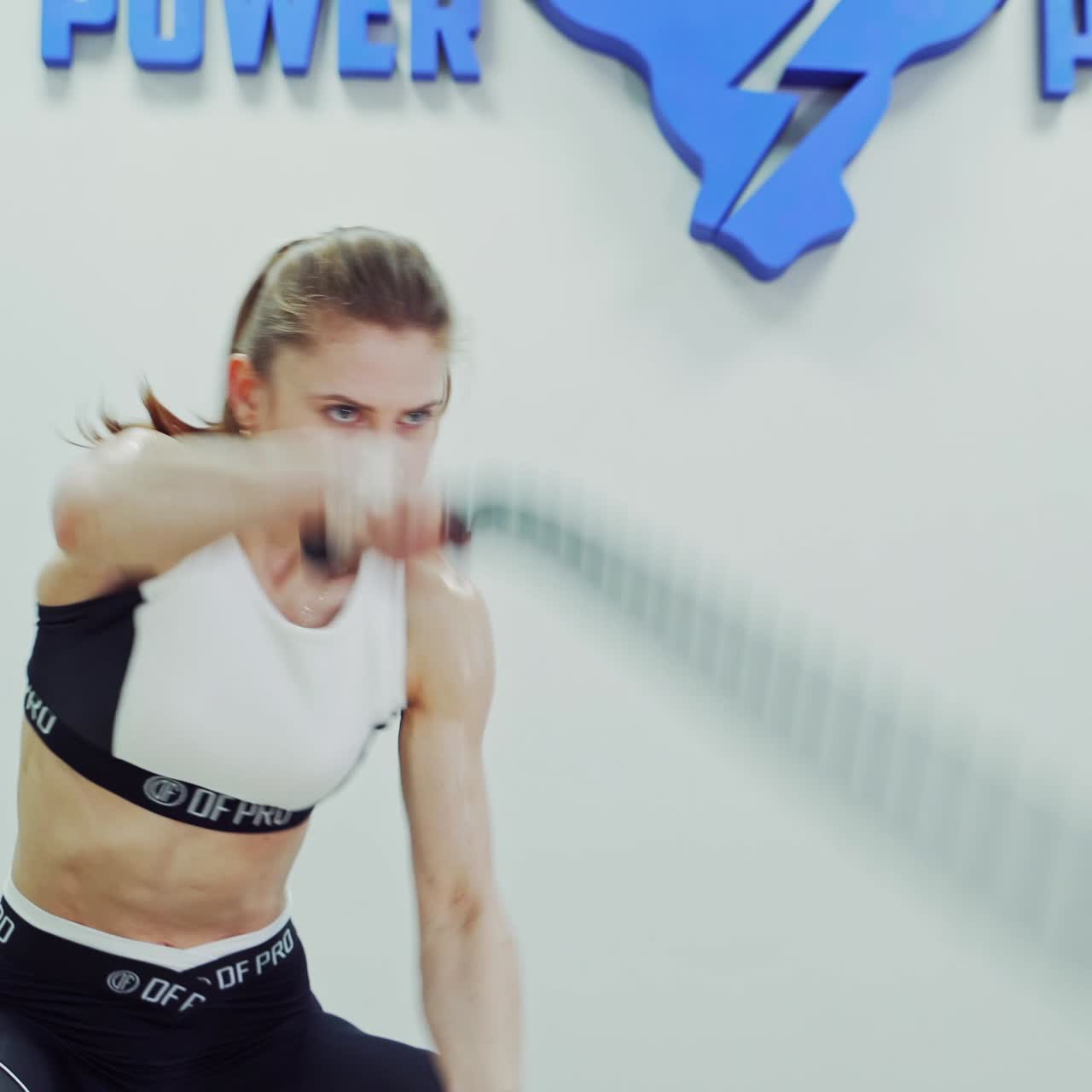 Girl doing exercises with sports equipment