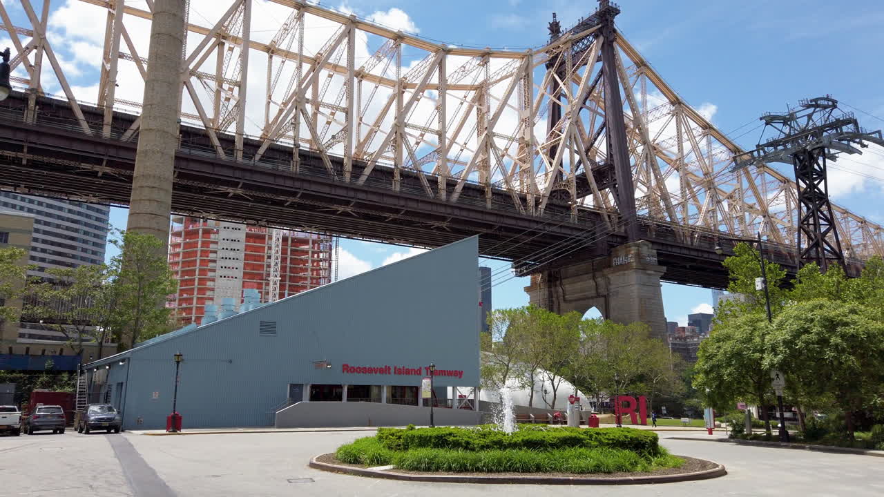 Roosevelt Island tramway terminal with Queensboro Bridge and Manhattan in the background.