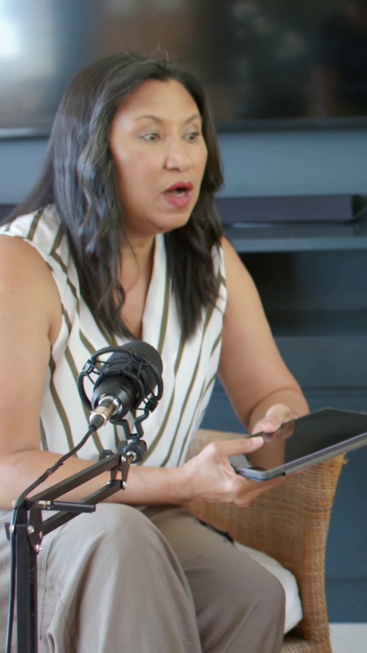 Vertical video: Tapping tablet, woman in striped top and pants speaking into mic for chat at home