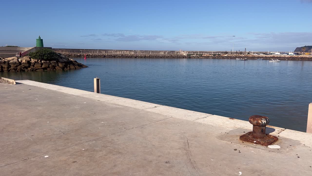 bay with yachts and boats in sunny weather under a clear blue sky