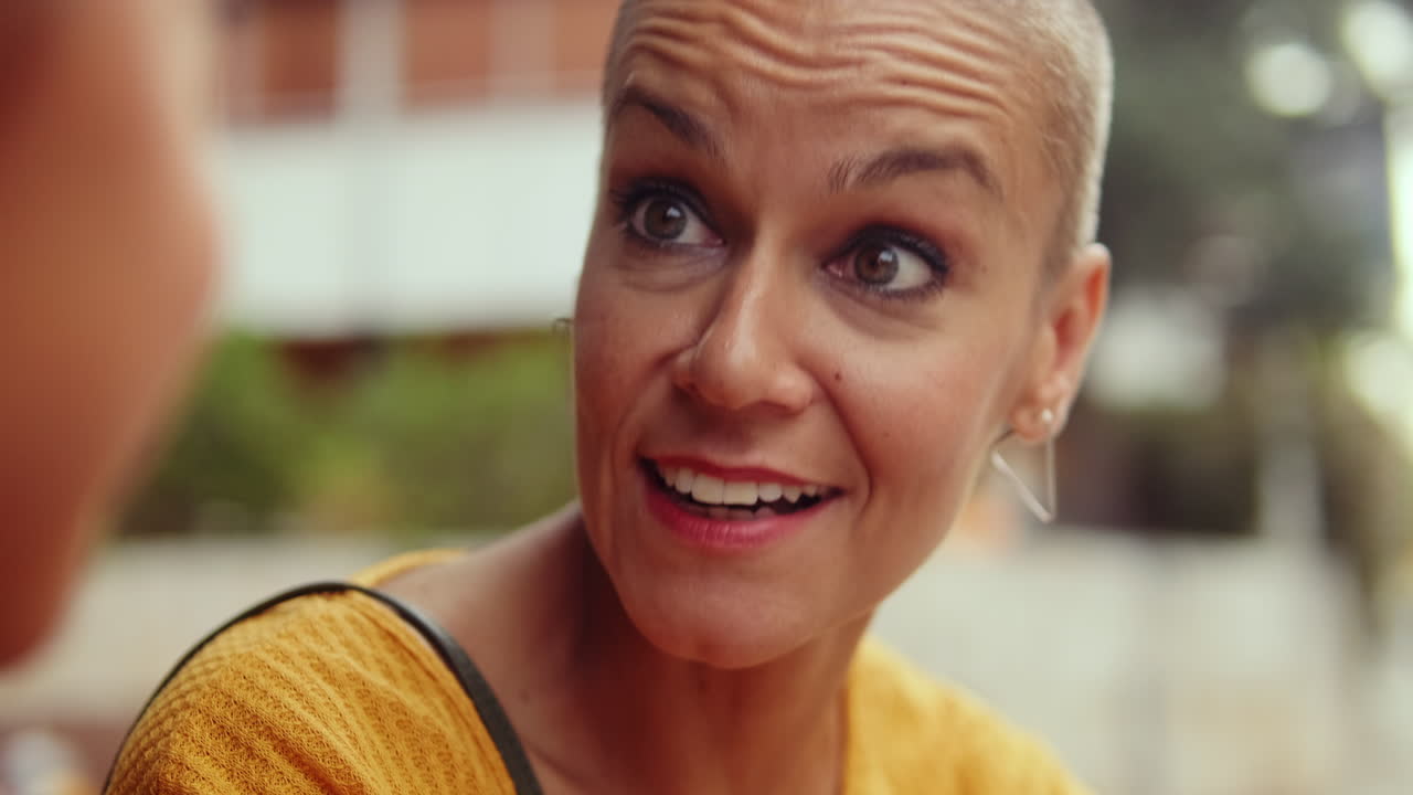 Mother And Daughter Talking and Laughing Together