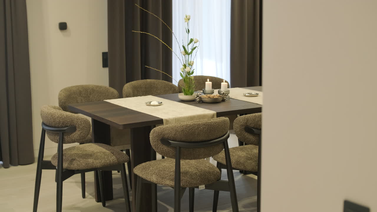 Modern Dining Room Interior with Elegant Table Setting and Lit Candles