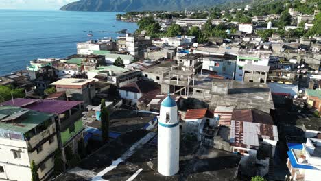 aerial view of village fisherman town in anjouan island, comoros africa indian ocean travel destination , drone fly above scenic coastline and traditional houses