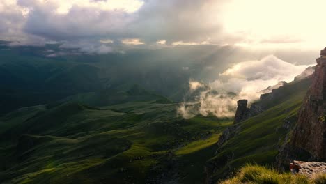 Low-clouds-over-a-highland-plateau-in-the-rays-of-sunset.-Sunset-on-Bermamyt-plateau-North-Caucasus,-Karachay-Cherkessia,-Russia.