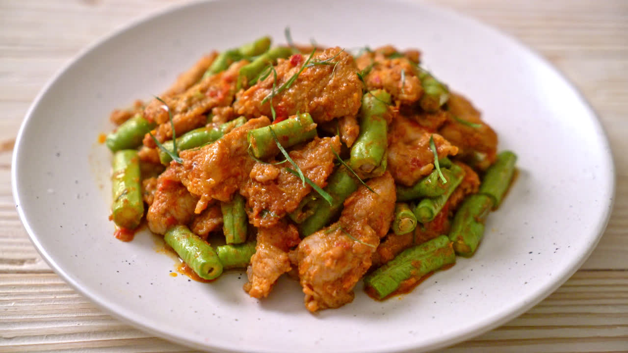 Stir fried pork and red curry paste with sting bean - Asian food style