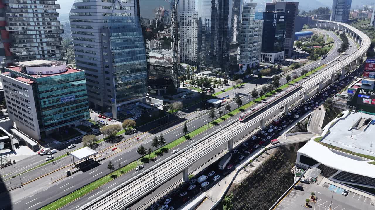 Train approaches Santa Fe station in Mexico City, drone footage
