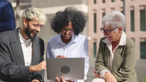 Diverse business team working together on a laptop