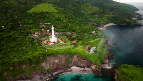 Aerial-View-Over-Lighthouse-In-Amed,-Bali,-Indonesia---Drone-Shot