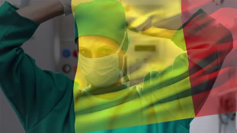 composición digital de la bandera belga ondeando contra una cirujana que lleva una máscara facial en el hospital