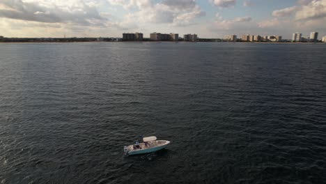 An-aerial-view-of-the-Atlantic-Ocean-off-a-Fort-Lauderdale,-Florida-beach-on-a-beautiful-day-with-blue-skies