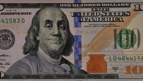 benjamin franklin nods approvingly over a dollar bill.