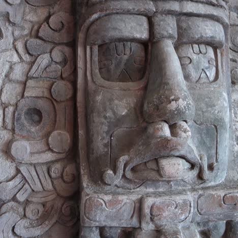 a carved mask at the mayan temple at yaxchilian