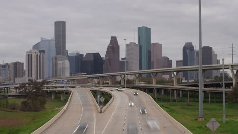 timelapse of cars on i-45 north freeway with downtown in the background in houston, texas