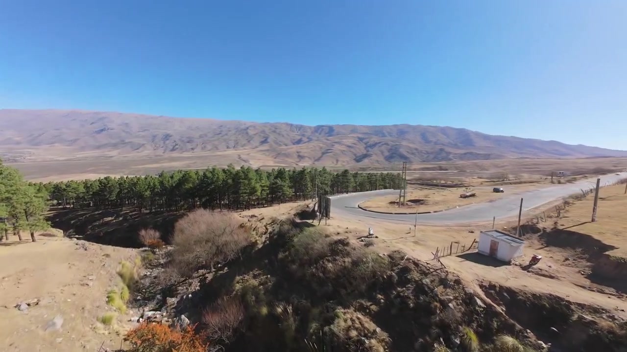 Drone Dolly In Over Tafí del Valle Landscape and Mountain Road, Tucumán, Argentina