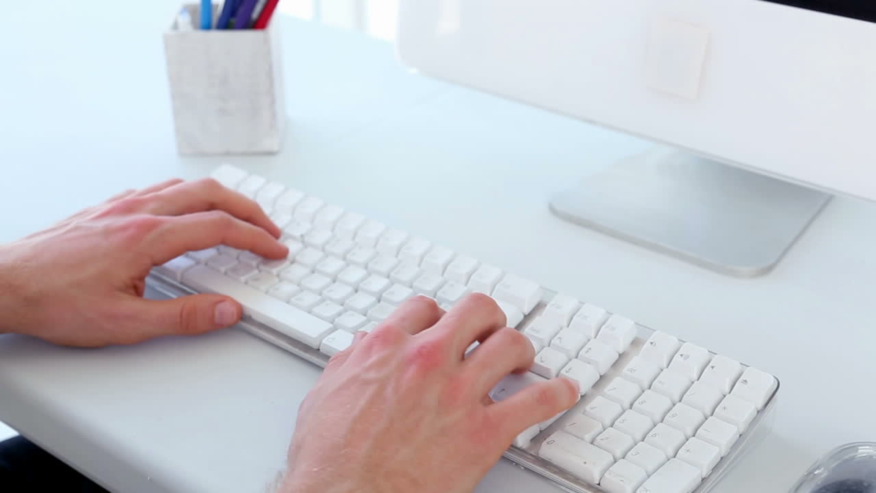 Businessman typing on keyboard