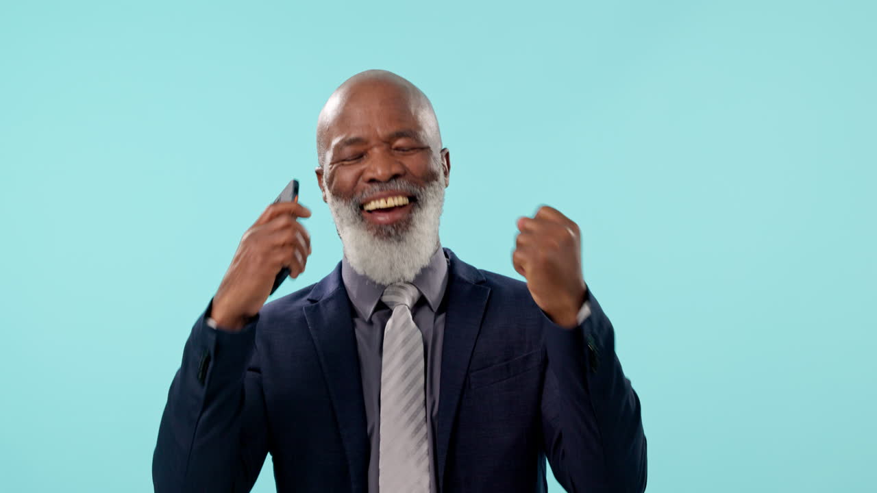Black man in studio with phone