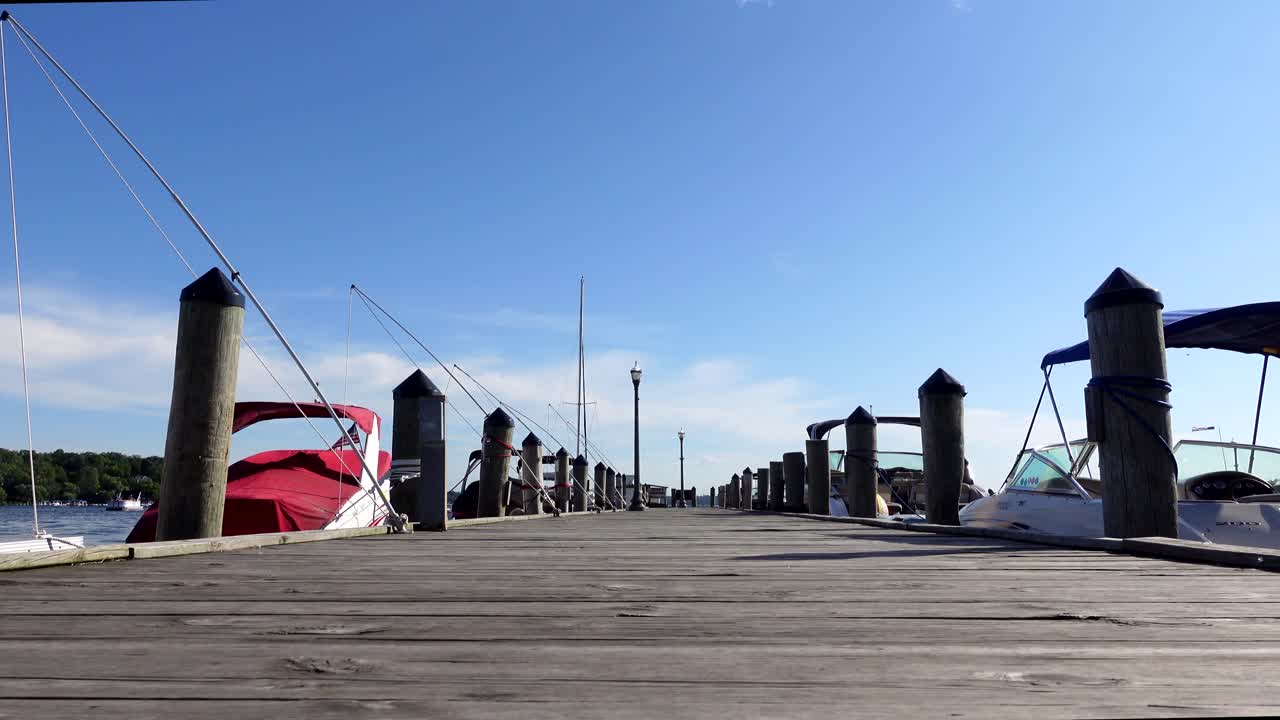 Looking down a pier on a bright sunny day, no person